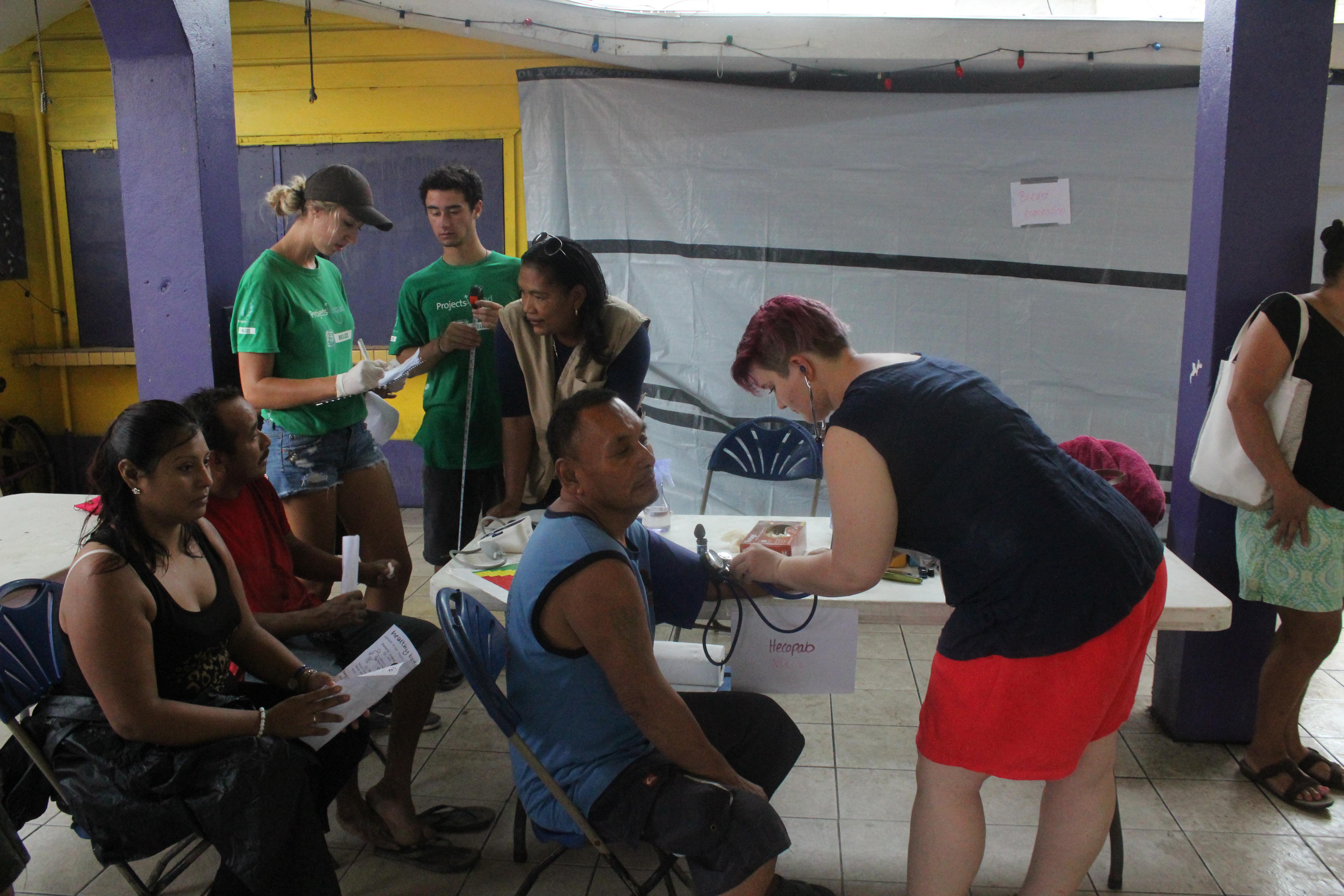 An intern with Projects Abroad measuring the blood sugar levels of a patient during her Public Health internship in Belize. Projects Abroad intern measuring blood sugar levels as part of her Public Health internship in Belize.